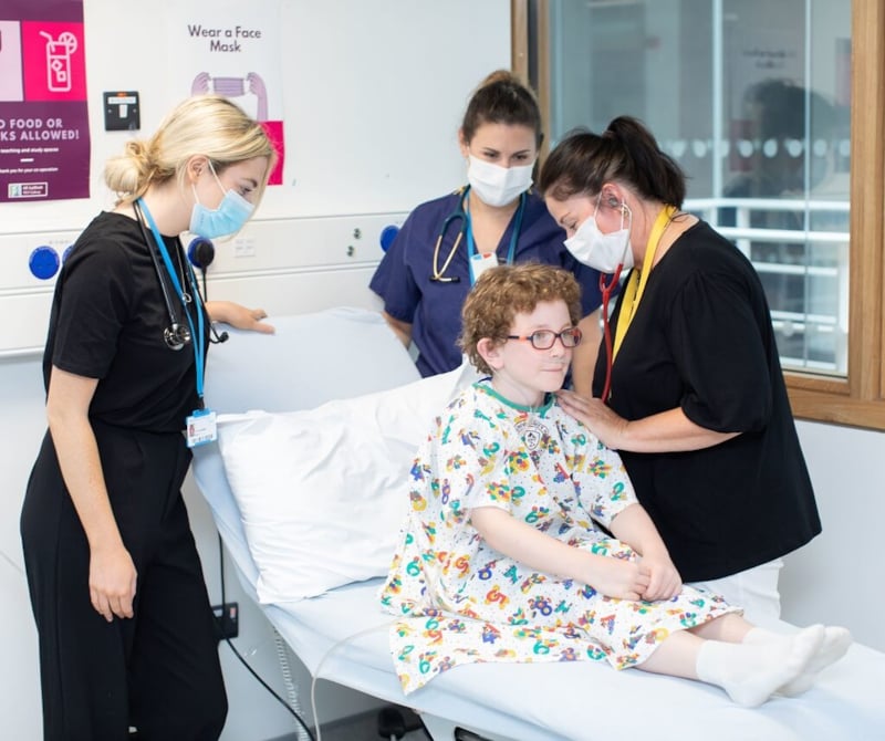 Child being examined by medical team